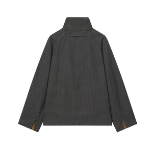 Detail of dark grey plaid jacket back featuring high collar and unique split cuffs design