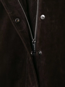 Detailed macro view of dark brown suede jacket texture with silver metal zipper and buttons