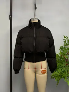 Close-up of windproof ribbed cuffs and hem on this cropped black puffer jacket