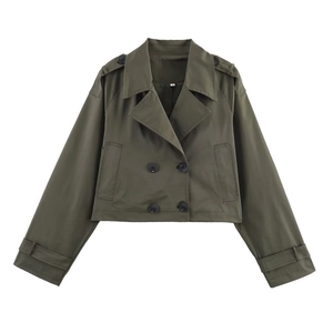 Close-up of military green short trench jacket with double-breasted buttons and epaulettes