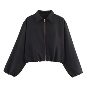 Women's black cropped puffer jacket with gold zipper and elastic cuffs on white background