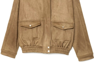 Detailed macro view of brown faux suede bomber jacket with large buttoned utility pockets