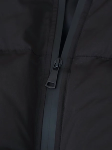 Detail of matte black metal zipper with waterproof adhesive tape on cotton jacket