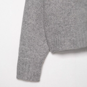Minimalist light gray knit sweater with high-quality ribbed cuffs and hem texture