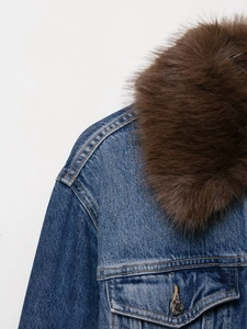 Detail of blue denim jacket showing faux fur collar and yellow stitching details