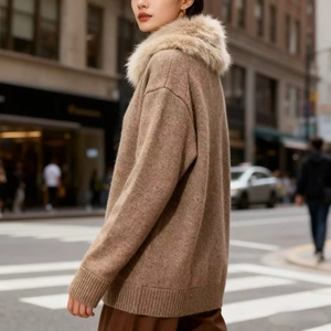 Women's dark brown knit cardigan with faux fur lapel collar in a stylish street style