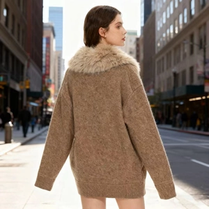 Women's brown knit cardigan with faux fur collar in a trendy oversized city style fit