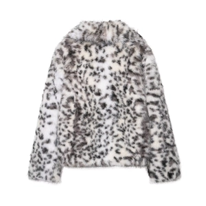 Close-up of snow leopard print faux fur texture on a long-sleeved cropped jacket