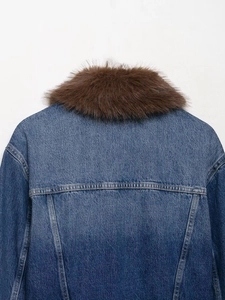 Macro detail of denim jacket back with thick faux fur collar and contrast topstitching
