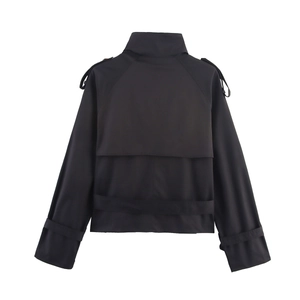 Back view of a cropped black windbreaker jacket featuring storm flaps and waist buckle details
