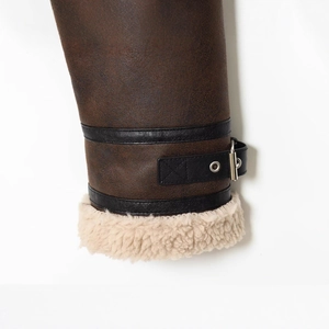 Women's brown faux leather cropped jacket with warm shearling lining and metal buckle