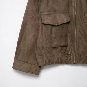 Brown faux suede jacket with metal zipper closure and large flap pockets on white background