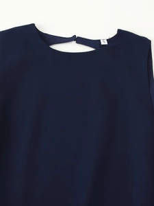 Close-up of dark blue dress neckline with back keyhole button and white size S label
