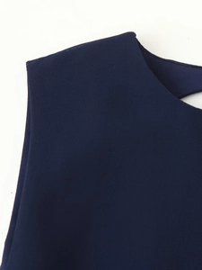 Detailed macro view of dark blue textured fabric with premium seamless stitching