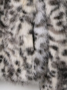 Close-up of thick leopard print faux fur texture on a stylish women winter jacket