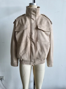 Detailed front view of a beige suede jacket featuring a high collar and large chest pockets