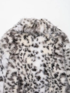 Detail view of faux fur texture with black and white animal print on jacket back