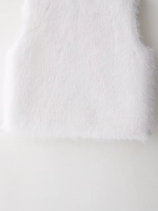 Detailed macro shot of premium white faux fur texture showing soft and fluffy plush fibers