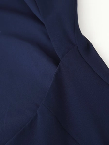 Macro shot of navy blue fabric stitching with fine twill texture for the dress detail