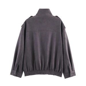 Detail view of the back of a faux suede bomber jacket with epaulettes and hem stitching