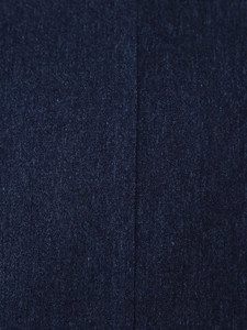 Detailed view of dark blue jacquard fabric texture and precise vertical stitching seam