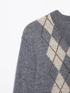Detail of grey argyle knit cardigan with ribbed collar and premium wool texture
