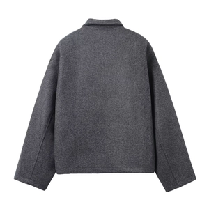 Detailed back view of dark grey loose wool jacket with textured fabric and drop shoulders