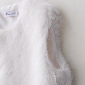 Minimalist white faux fur vest for women with soft shaggy texture and smooth lining