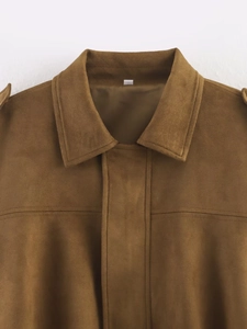 Detailed view of brown faux suede bomber jacket collar with shoulder epaulette and topstitching