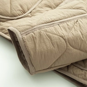 Quilted round neck long sleeve padded jacket in khaki with curved diamond patterns