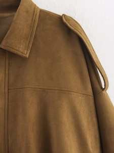 Detail shot of caramel faux suede jacket showing collar lapels and shoulder epaulettes