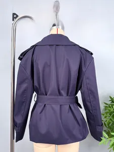 Rear view of a short navy blue trench jacket featuring an adjustable waist belt