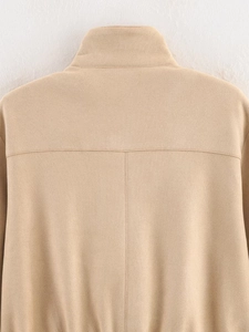 Detailed back view of khaki faux suede jacket showing seams and velvet texture