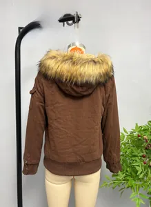 Detail view of brown bomber jacket featuring a detachable faux fur collar and ribbed cuffs