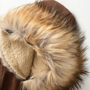Detail of the warm faux fur collar and cozy fleece lining on a brown winter jacket