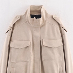 Beige faux suede utility jacket featuring a stand collar, shoulder straps and flap pockets