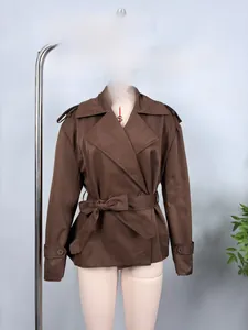 Detail of a brown short trench jacket with belt, epaulets, and cuffed sleeves