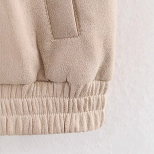 Women's beige suede jacket featuring a stand collar and ribbed hem details
