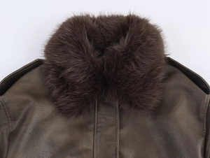 Close-up of faux suede jacket with plush detachable faux fur collar and neat stitching