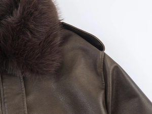 Close-up of a dark brown faux suede jacket featuring a thick matching faux fur collar detail