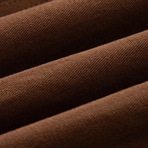 Detailed close-up showing the premium brown twill fabric texture of this jacket
