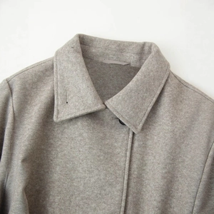 Light gray double collar wool coat with refined lapel detail and button closure