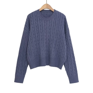 Women's blue cable knit sweater with a round neck and casual loose-fit dropped shoulders
