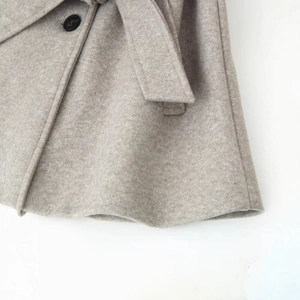 Oatmeal wool coat with double collar, matching waist belt and premium brown button detail