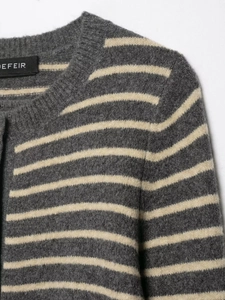 Detailed view of striped knit cardigan with plush texture and round neckline