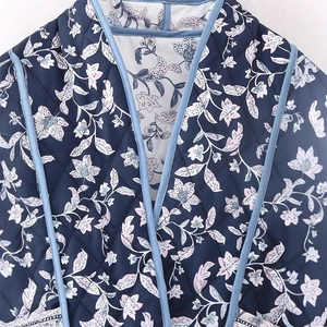 Quilted floral reversible jacket with diamond patterns and light blue contrast piping