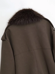 Detailed back view of dark brown leather jacket with plush faux fur collar and stitching