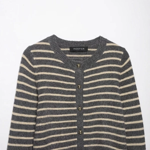 Classic grey and white striped knit cardigan with round neck and gold metal buttons