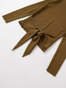 Detailed view of the ribbed knit texture and decorative bow tie on olive brown sweater
