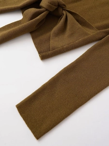 Detail view of olive green knit sweater showing the fine ribbed cuff and premium texture